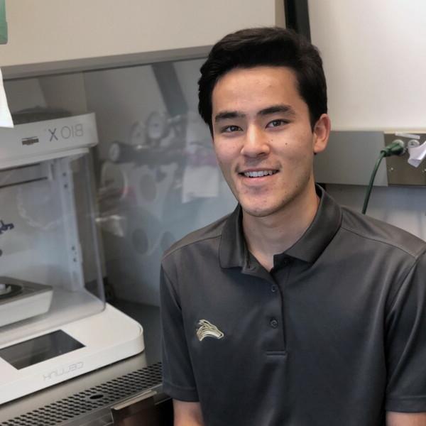 Anthony Baker, psychology student, in a lab doing research.